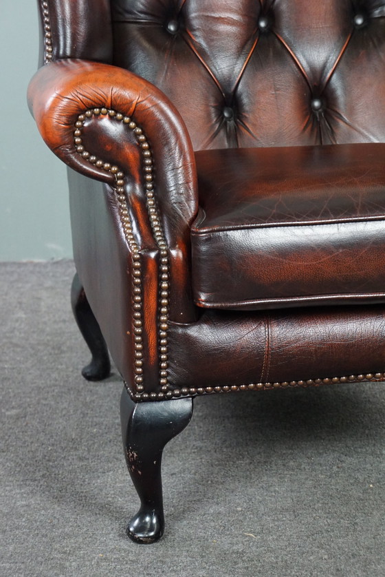 Image 1 of Cowhide Chesterfield wing armchair