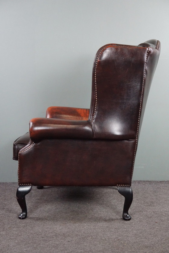 Image 1 of Cowhide Chesterfield wing armchair