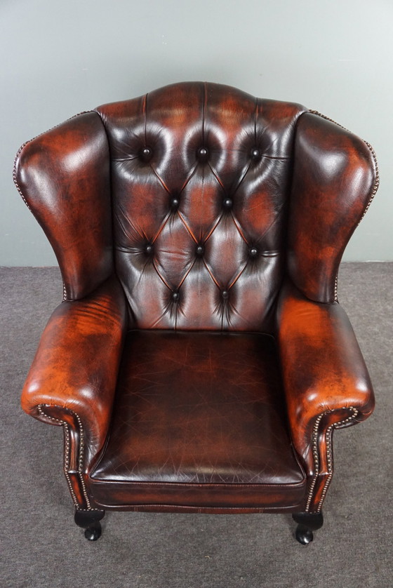 Image 1 of Cowhide Chesterfield wing armchair