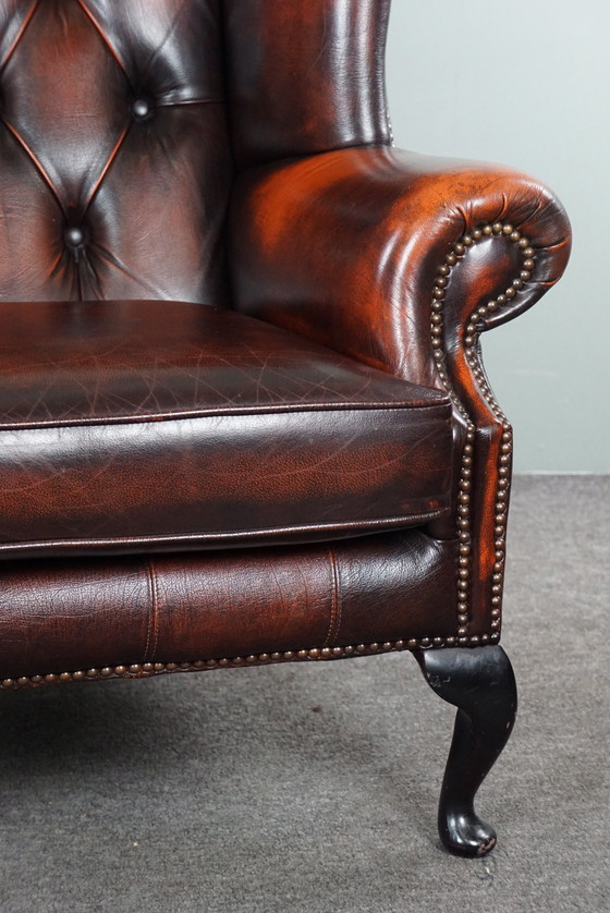 Image 1 of Cowhide Chesterfield wing armchair