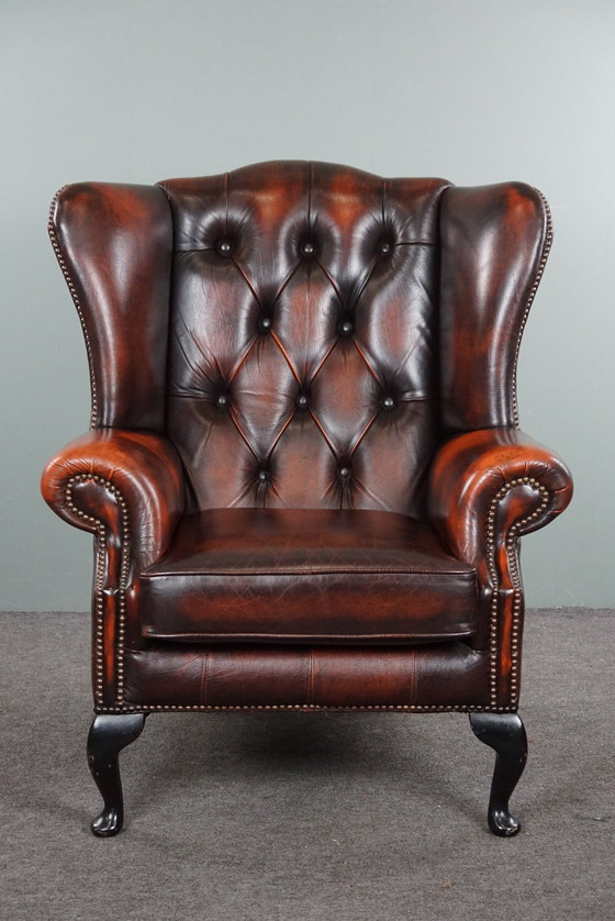 Image 1 of Cowhide Chesterfield wing armchair