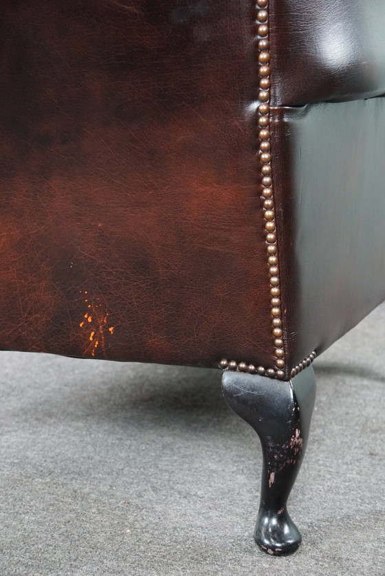 Image 1 of Cowhide Chesterfield wing armchair