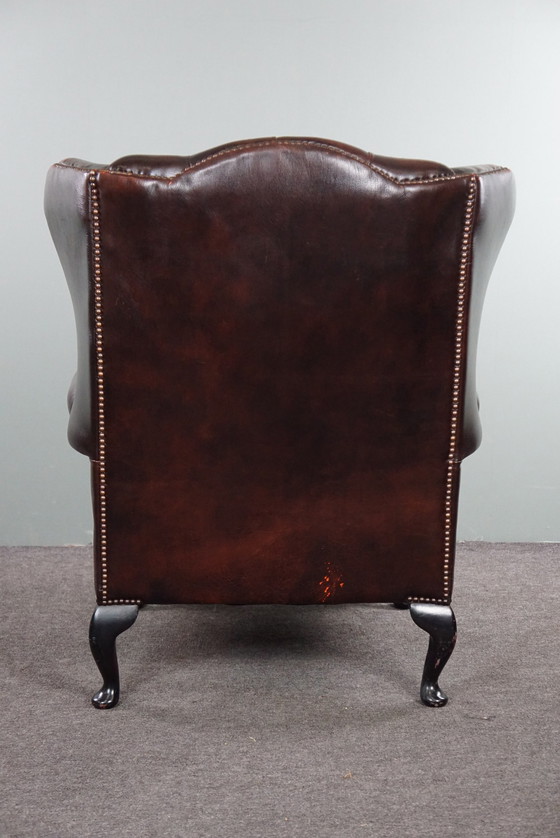 Image 1 of Cowhide Chesterfield wing armchair