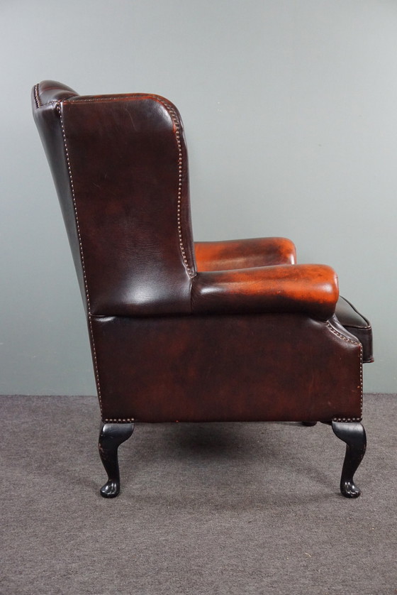 Image 1 of Cowhide Chesterfield wing armchair