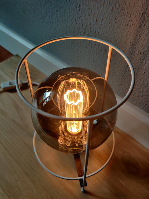 Upcycled titanium filament lamp