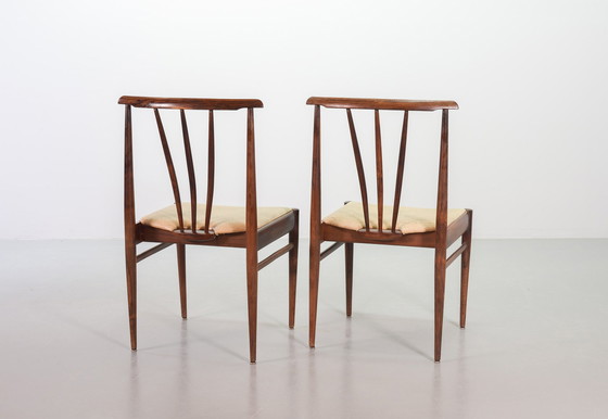 Image 1 of Scandinavian dining room chairs with spindle back made of solid rosewood and caramel-colored artificial leather upholstery. Set 