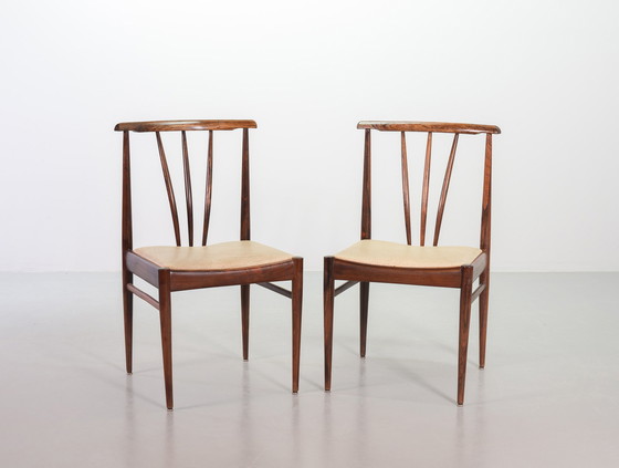 Image 1 of Scandinavian dining room chairs with spindle back made of solid rosewood and caramel-colored artificial leather upholstery. Set 