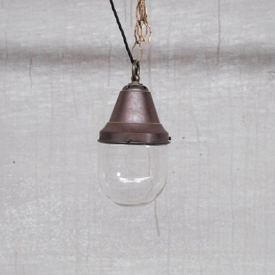 Image 1 of Paire de lampes suspendues industrielles en laiton et verre transparent, années 1930
