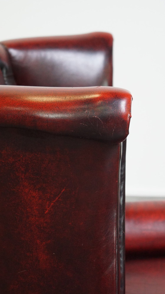 Image 1 of Grand fauteuil Chesterfield rouge à oreilles