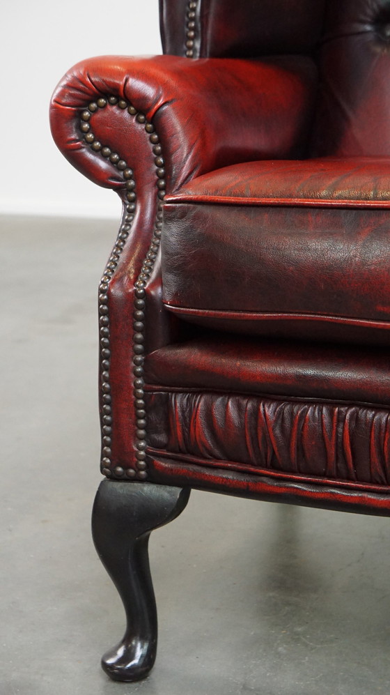 Image 1 of Grand fauteuil Chesterfield rouge à oreilles