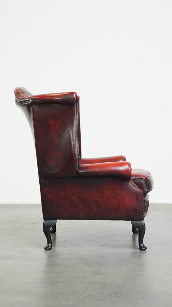 Image 1 of Grand fauteuil Chesterfield rouge à oreilles