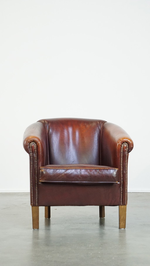 Fauteuil club en peau de mouton couleur cognac