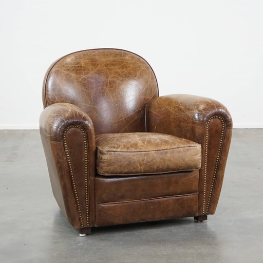 Fauteuil en cuir de boeuf hérité, fini avec des clous décoratifs