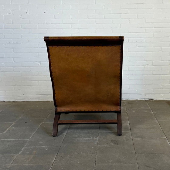 Image 1 of Fauteuil de repos colonial vintage + Ottoman marron