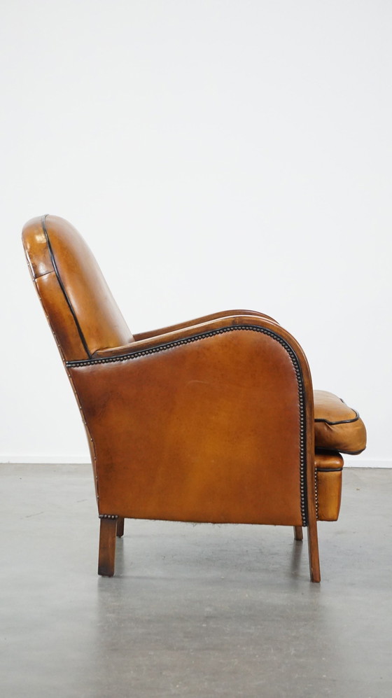 Image 1 of Fauteuil en cuir de mouton combiné avec du bois