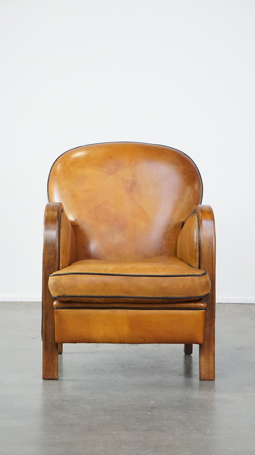 Fauteuil en cuir de mouton combiné avec du bois