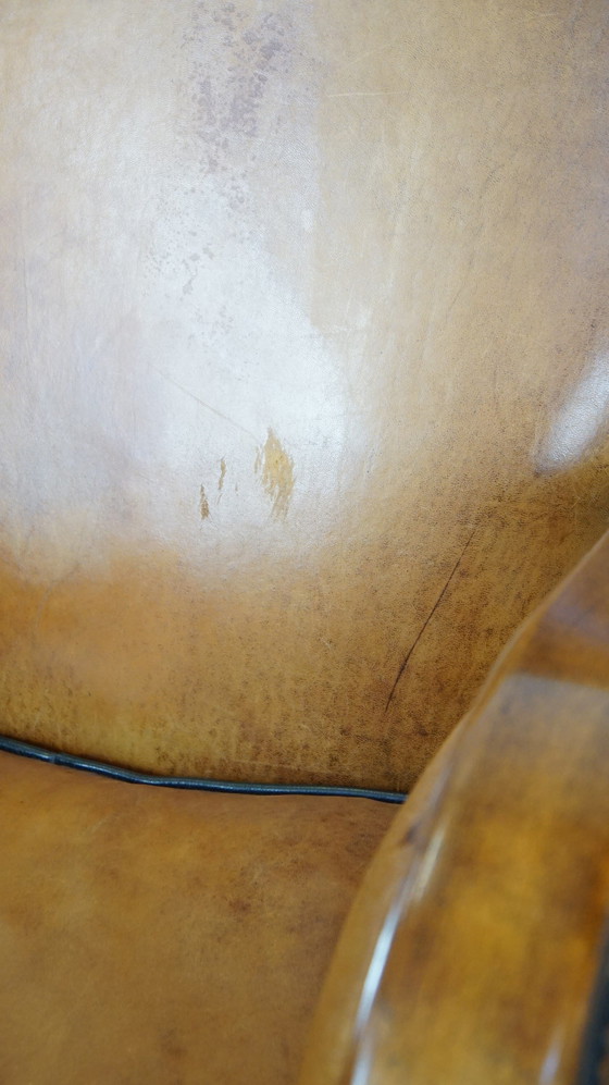 Image 1 of Fauteuil en cuir de mouton combiné avec du bois