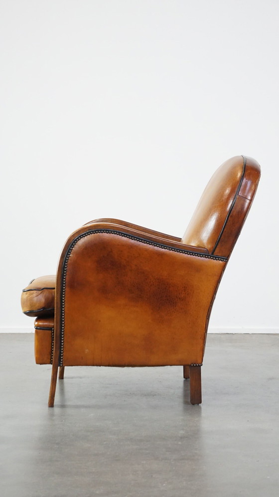 Image 1 of Fauteuil en cuir de mouton combiné avec du bois