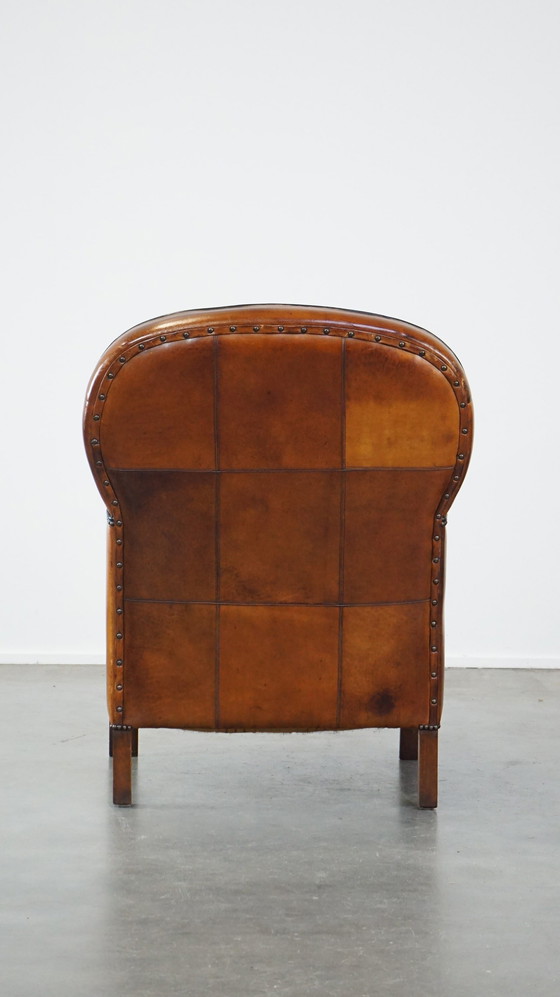 Image 1 of Fauteuil en cuir de mouton combiné avec du bois