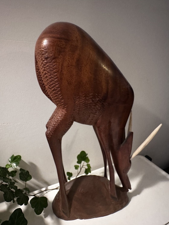 Image 1 of Décoration vintage sculptée en bois cerf