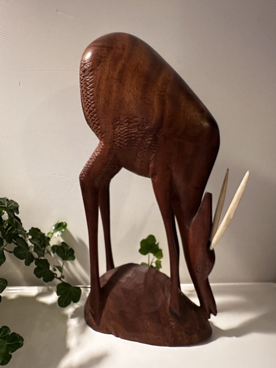 Image 1 of Décoration vintage sculptée en bois cerf