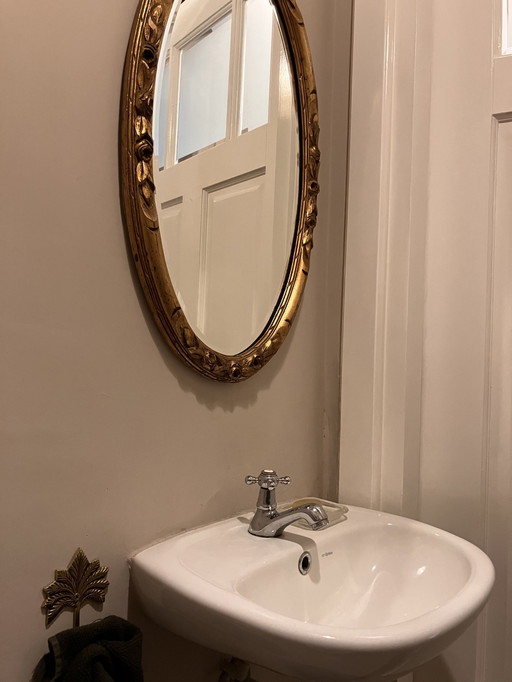 Miroir or antique ovale