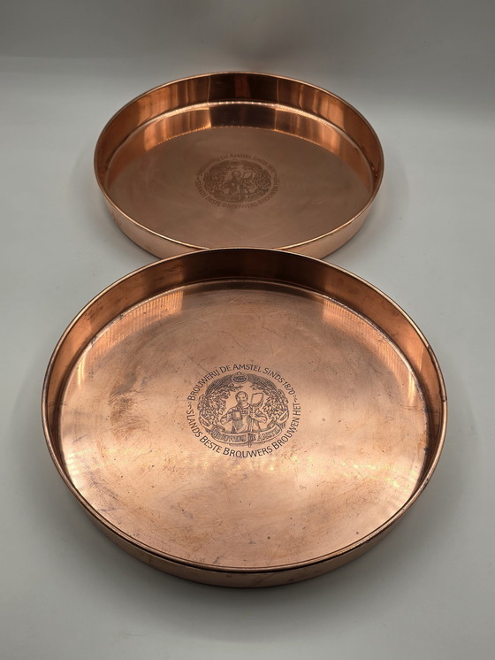 Image 1 of 2 X plateaux de service en cuivre rouge vintage Amstel Beer
