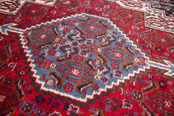 Image 1 of Tapis d'Orient en nuances de rouge