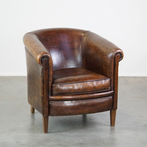 Fauteuil club en cuir de mouton foncé