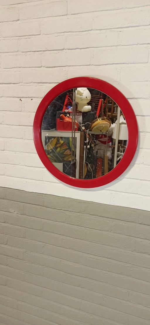 Miroir rond à cadre rouge