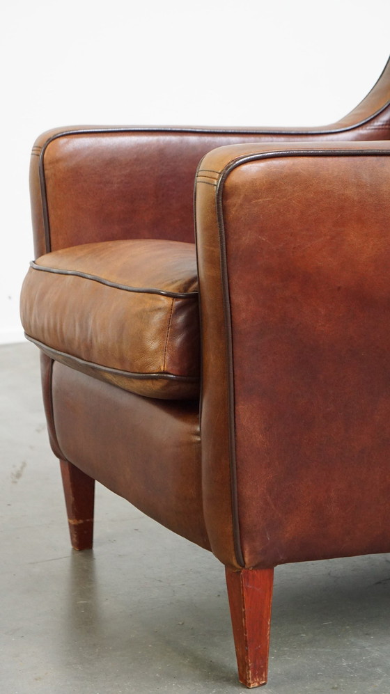 Image 1 of Fauteuil en peau de mouton avec passepoil marron foncé