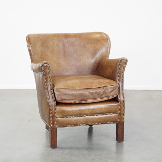 Image 1 of Fauteuil en cuir de boeuf avec un coussin d'assise réversible en kelim