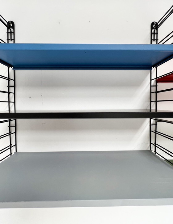 Image 1 of Étagère murale Tomado bleu/rouge, neuf pièces, A. Dekker, 1950's