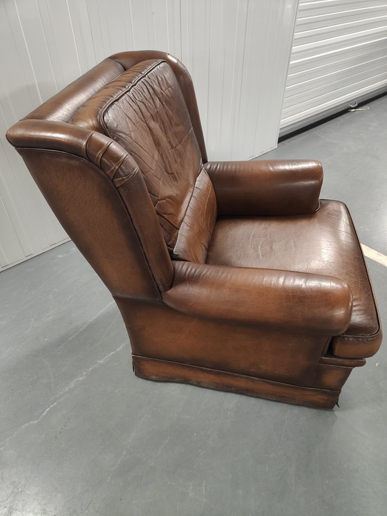 Image 1 of Fauteuil à oreilles en peau de mouton avec coussin d'assise lâche, marque : Muylaert