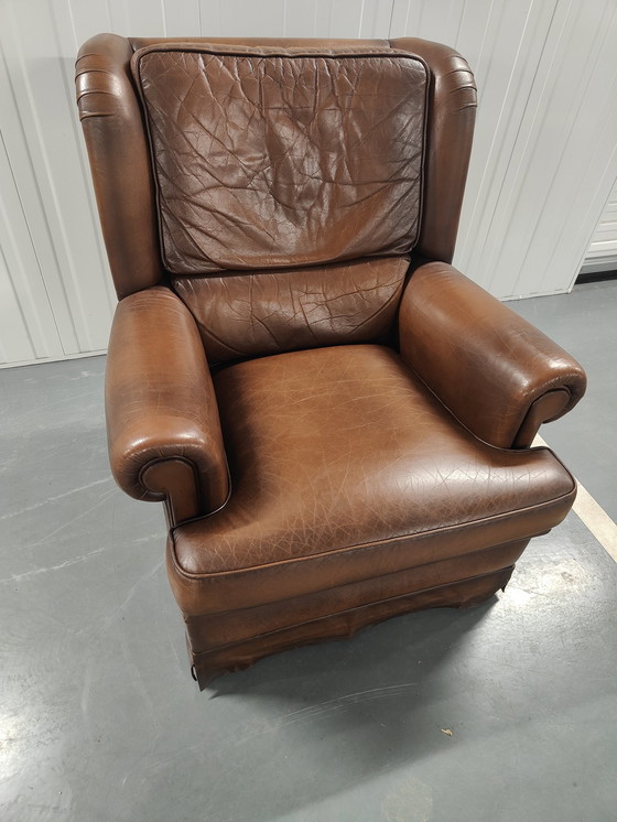 Image 1 of Fauteuil à oreilles en peau de mouton avec coussin d'assise lâche, marque : Muylaert