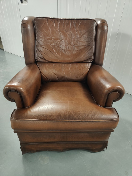 Image 1 of Fauteuil à oreilles en peau de mouton avec coussin d'assise lâche, marque : Muylaert