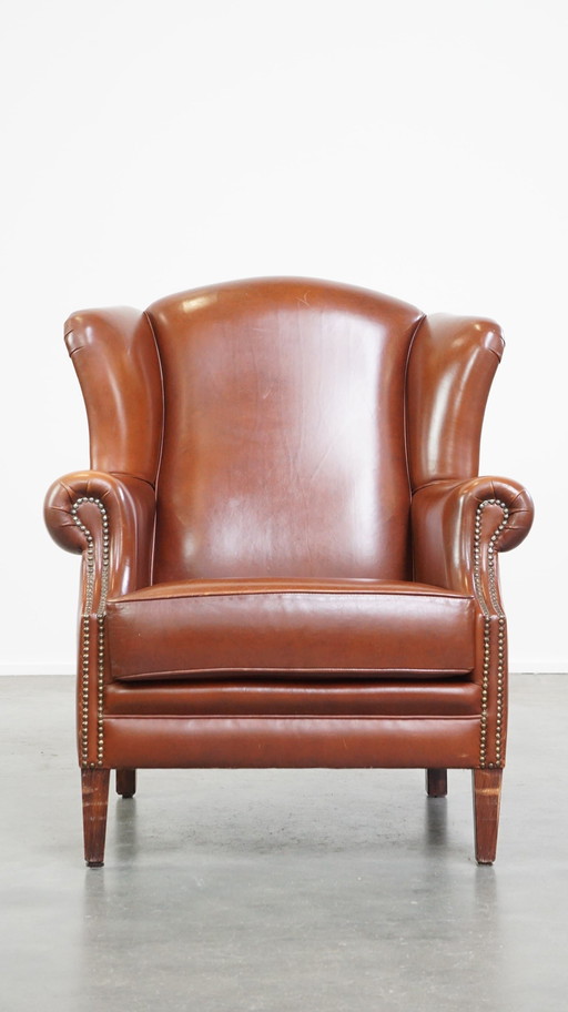 Fauteuil à oreilles en cuir de boeuf