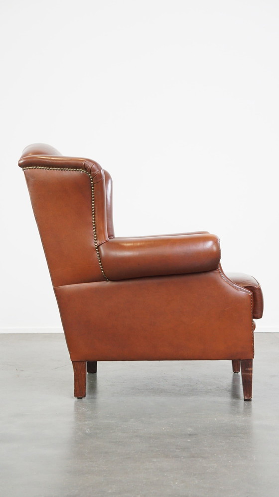 Image 1 of Fauteuil à oreilles en cuir de boeuf