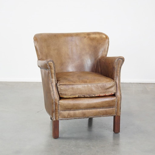 Fauteuil en cuir de boeuf avec coussin d'assise réversible en kelim