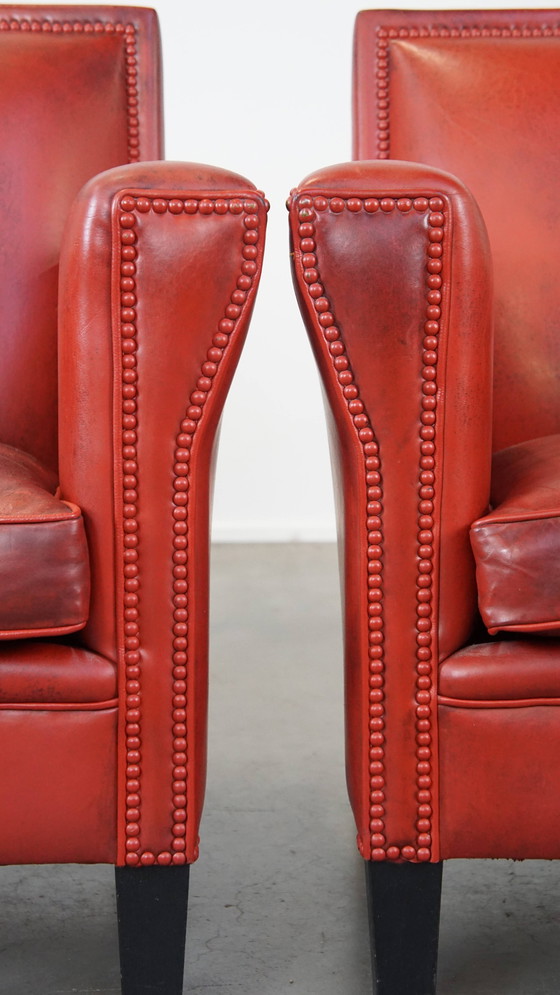 Image 1 of 2 X fauteuils design en peau de mouton de couleur rouge