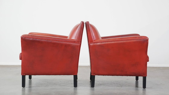 Image 1 of 2 X fauteuils design en peau de mouton de couleur rouge