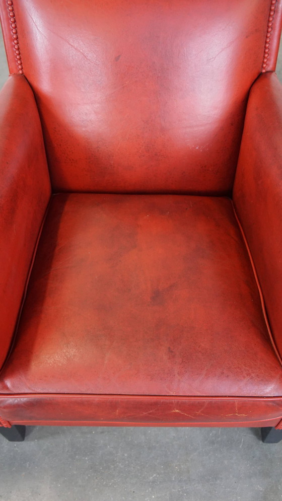 Image 1 of 2 X fauteuils design en peau de mouton de couleur rouge