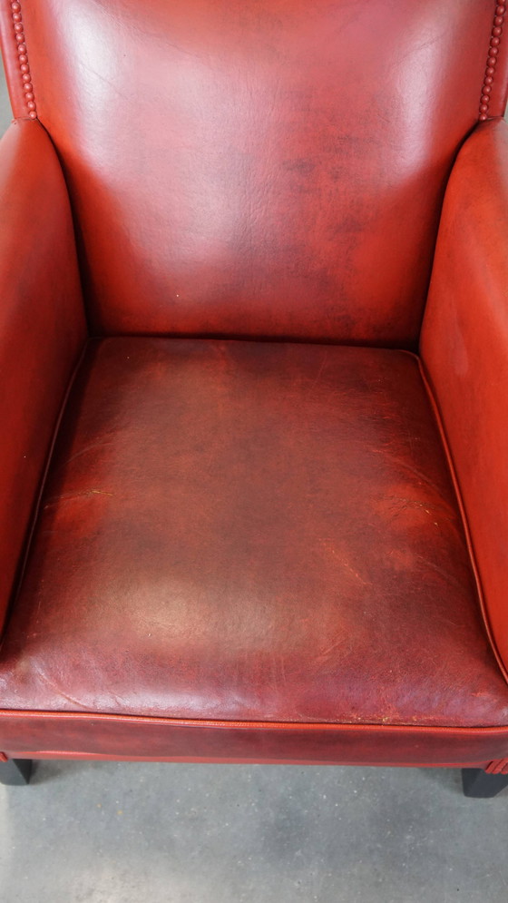 Image 1 of 2 X fauteuils design en peau de mouton de couleur rouge