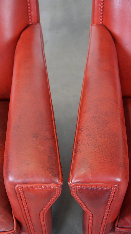 Image 1 of 2 X fauteuils design en peau de mouton de couleur rouge