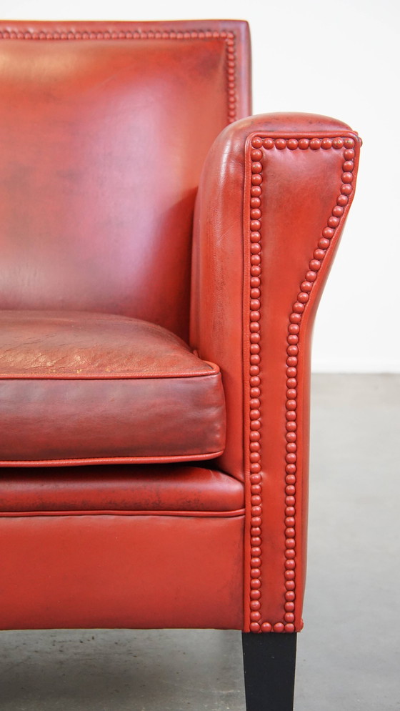 Image 1 of Fauteuil rouge en peau de mouton