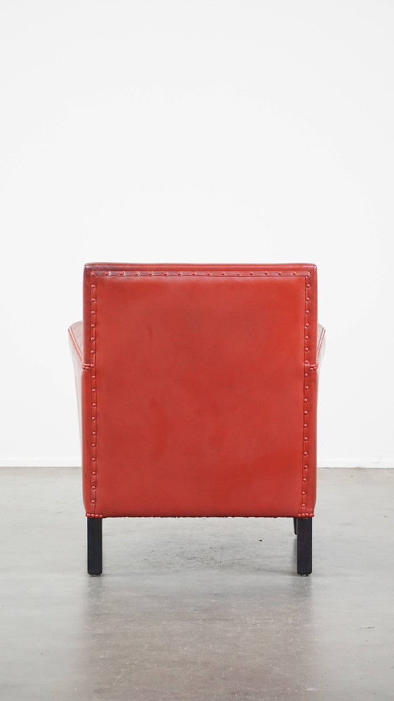 Image 1 of Fauteuil rouge en peau de mouton