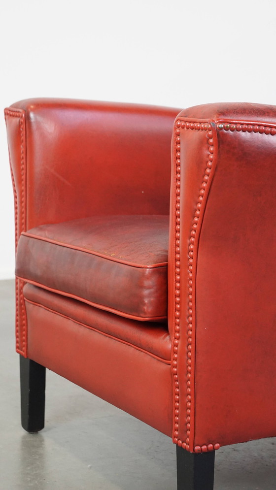 Image 1 of Fauteuil rouge en peau de mouton