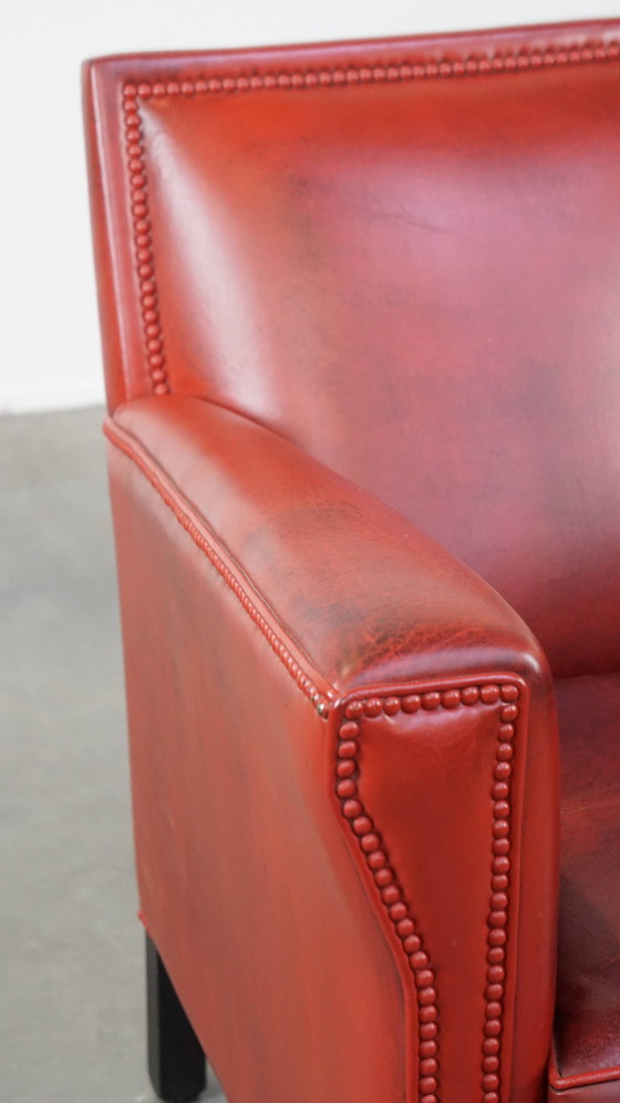 Image 1 of Fauteuil rouge en peau de mouton