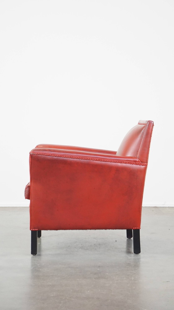 Image 1 of Fauteuil rouge en peau de mouton