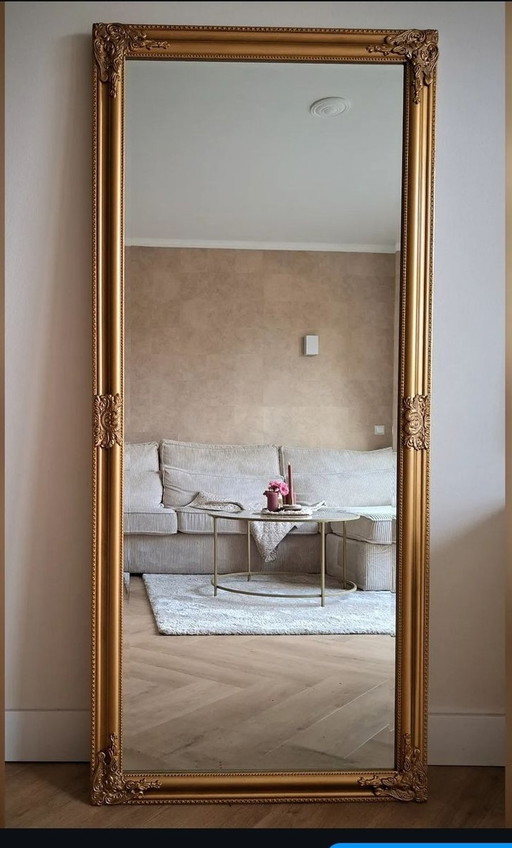 Miroir d'aspect antique en bronze doré avec facettes